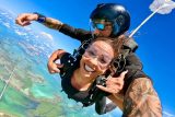 Two tandem skydivers from Skydiving Key West enjoying the Summer weather in Key West, Florida