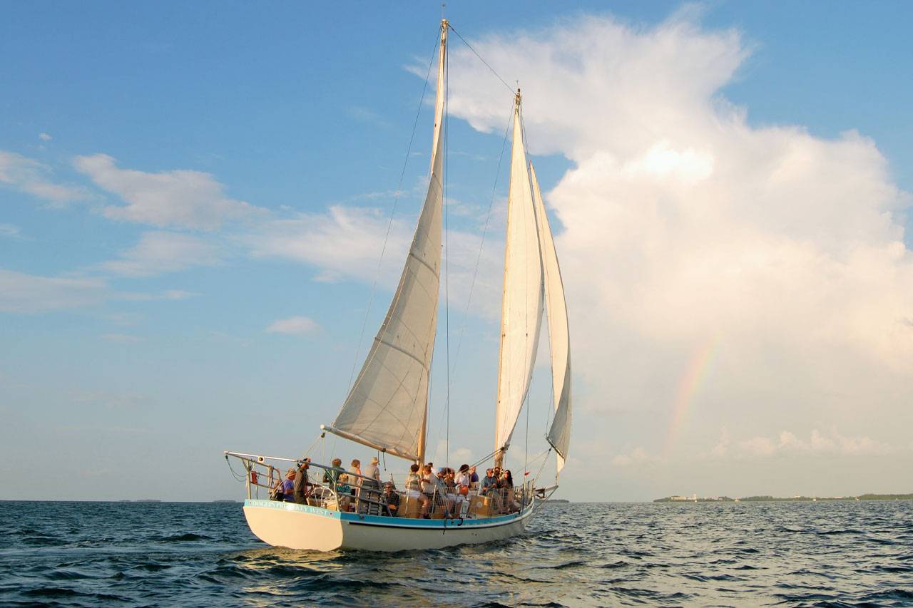 Group aboard a schooner enjoying a day sail in Key West with Danger Charters