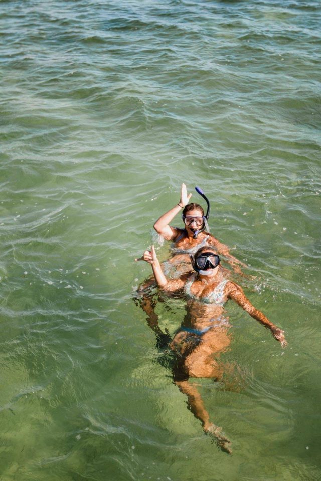 Two women in bikinis snorkeling in Key West