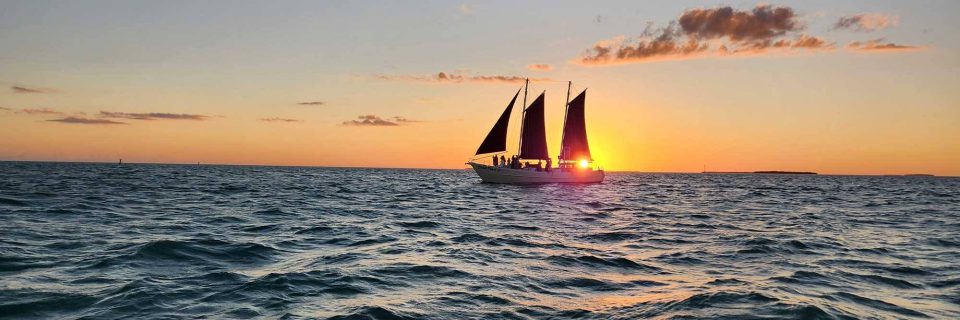 A schooner on the water at sunset in Key West, FL