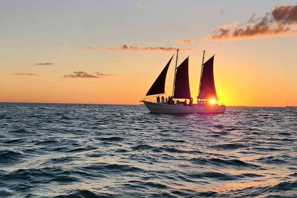 A schooner on the water at sunset in Key West, FL