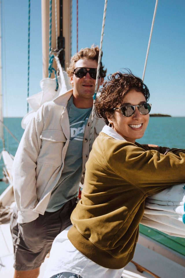 Couple smiling and enjoying a private sailing charter in Key West with Danger Charters