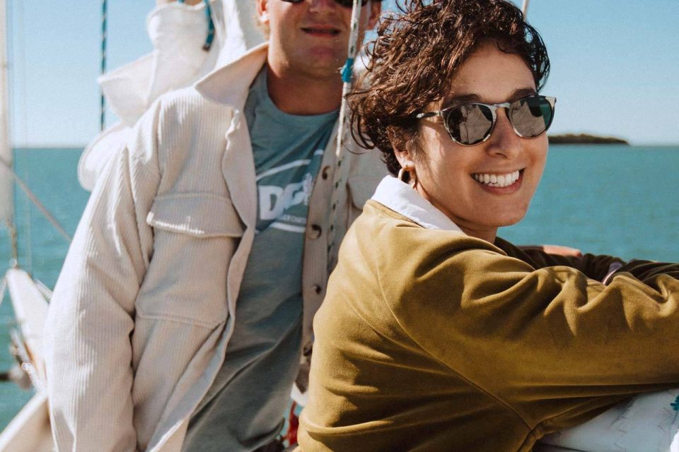 Couple smiling and enjoying a private sailing charter in Key West with Danger Charters