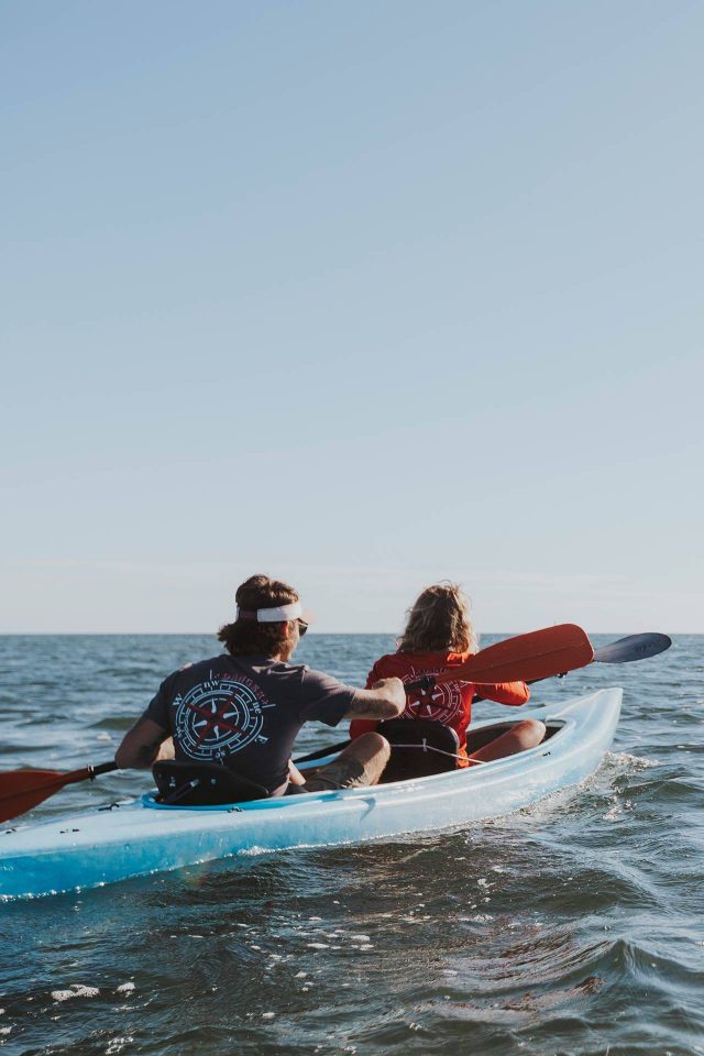 A couple kayaking out to a barrier reef in Key West, Florida