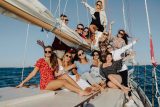 A group of young women pose for a photo while on a sailing charter with Danger Charters in Key West, FL