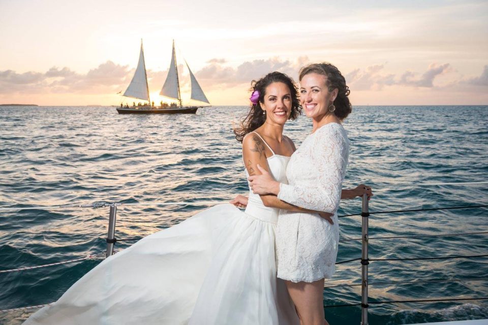 A female couple celebrates their wedding aboard a schooner in Key West, FL