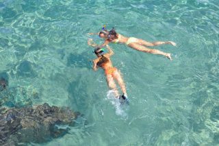 Two kids enjoying snorkeling with Danger Charters in Key West